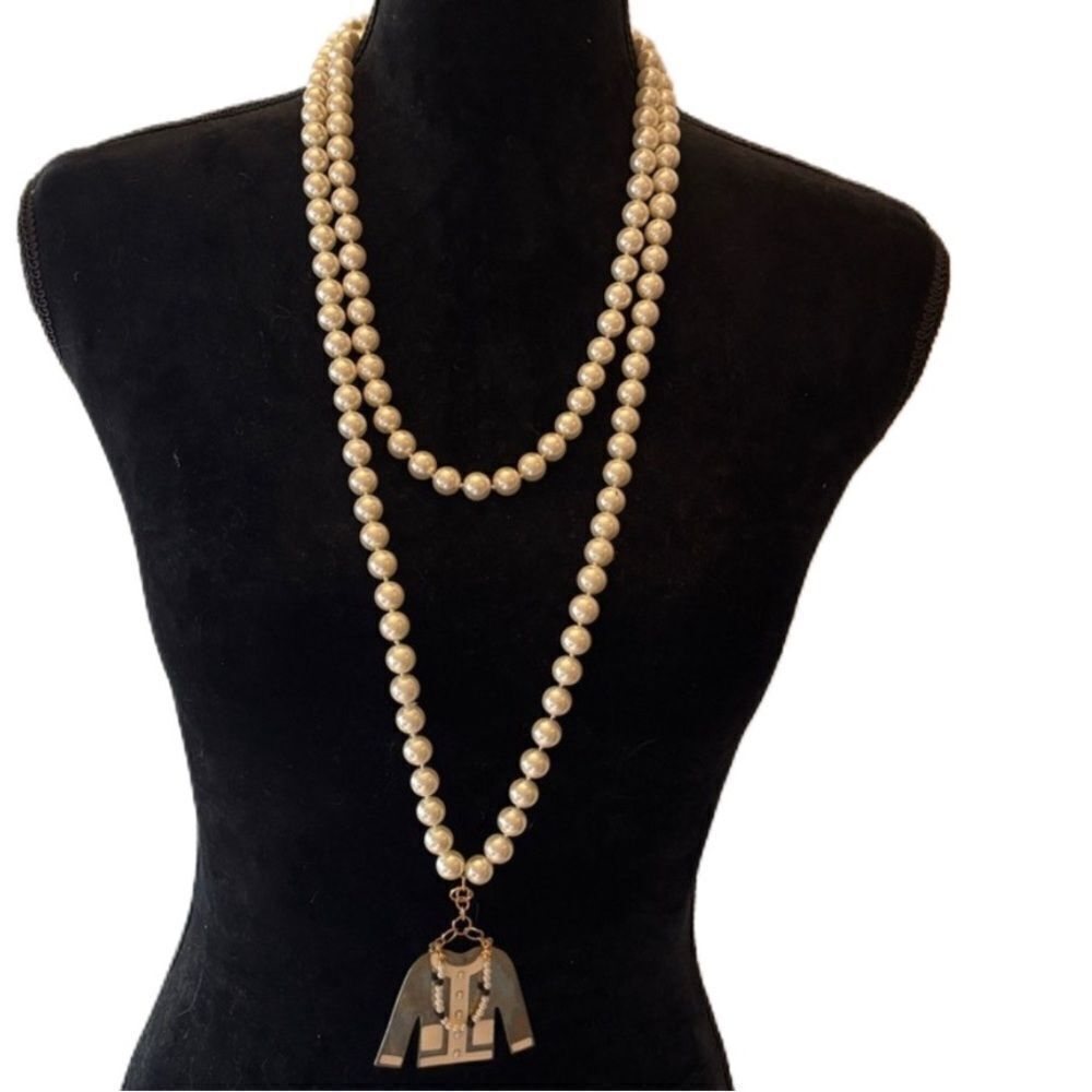 Vintage 29 inch pearls with a charm.